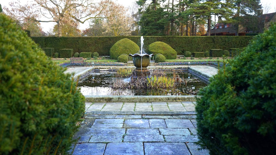 Discover serenity in a beautifully manicured garden with a central fountain, offering a peaceful retreat in the UK.